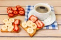 Coffee and toast with strawberries and bananas Royalty Free Stock Photo