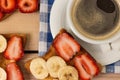 Coffee and toast with strawberries and bananas Royalty Free Stock Photo