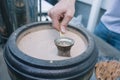 Coffee in turk preparing on hot sand - Street food Royalty Free Stock Photo