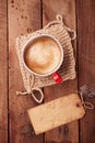 Coffee in unusual vintage tin mug with grunge paper tag