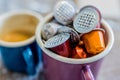 Coffe pods in enamel mug Royalty Free Stock Photo