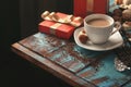 Coffee with variety of candy, chocolate bar and gift box Royalty Free Stock Photo