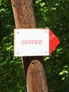 Coffee Sign On A Tree Pointing Right