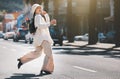 Coffee, walking and woman travel in city with trendy clothes for commute, transport and adventure. Relax, worker and Royalty Free Stock Photo
