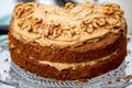 A Coffee and Walnut Cake on a Cake Stand for Afternoon Tea Royalty Free Stock Photo