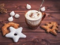 Coffee with whipped cream and chocolate. White, brown biscuit, bisa biscuit on a wooden tray. Vintage silver boat dropped into the Royalty Free Stock Photo