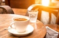 Coffee,White Coffee Mug,Glass water,Wooden table. Royalty Free Stock Photo