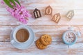 Coffee in white cup and cookies on a white table and the white alarm clock the top view Royalty Free Stock Photo