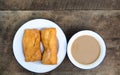 Coffee in a white cup and fried bread Royalty Free Stock Photo