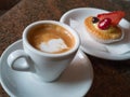 Coffee in a White Cup and Fruit Pastry with Strawberry and Cream