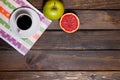 Coffee in white cup with green apple and sliced grapefruit Royalty Free Stock Photo