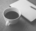 Coffee in white cup with Journal book and pencil Royalty Free Stock Photo