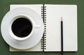 Coffee in white cup with Journal book and pencil Royalty Free Stock Photo