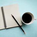 Coffee in white cup with Journal book and pencil Royalty Free Stock Photo