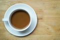 Coffee in a white cup on wooden table background for copy space, Flat lay, Table top view. Royalty Free Stock Photo