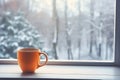 Coffee on the window sill, a tranquil winter morning