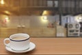 Coffee on wooden table with abstract blur of counter bar Royalty Free Stock Photo