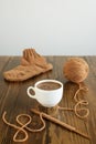 Coffee, woolen sock and knitting on a table Royalty Free Stock Photo