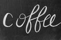 Coffee word handwritten with chalk on blackboard