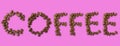 Coffee word made of coffee beans on pink background - close up concept - stock