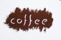 Coffee word written on ground coffee layer, white background