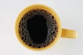 Coffee in yellow mug Royalty Free Stock Photo
