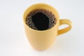 Coffee in yellow mug Royalty Free Stock Photo