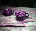Coffeebeans in ceramic coffee cups Royalty Free Stock Photo