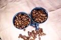Coffeebeans in ceramic coffee cups Royalty Free Stock Photo