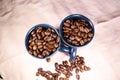 Coffeebeans in ceramic coffee cups