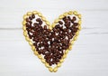 Coffeebeans heart on a wooden board