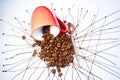 Coffeebeans and a red espresso cup on a table