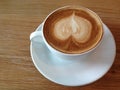 Coffeecup of with heart shape art on foam Royalty Free Stock Photo