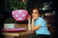 Tired Woman Having a Huge Cup of Coffee in a Restaurant