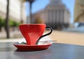 Coffeetime concept with a red cup of coffee shot outdoor Royalty Free Stock Photo