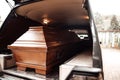 coffin in the back of a car at a funeral Royalty Free Stock Photo