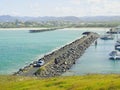 Coffs Harbour Marina rock breakwall and ocean timber jetty Royalty Free Stock Photo