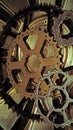 Cog wheels, rust colored on gold Royalty Free Stock Photo