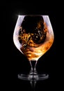 Cognac or brandy on a black Royalty Free Stock Photo