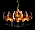 Cognac or brandy on a black Royalty Free Stock Photo