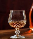 Crystal glass of cognac, brandy on a wooden bar counter Royalty Free Stock Photo