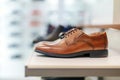 Cognac-colored leather men`s shoes