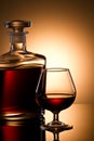 Cognac glass and bottle Royalty Free Stock Photo