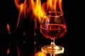 Cognac glass with the burning fire flames Royalty Free Stock Photo