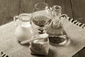 Cognac in a glass goblet, milk, water, sugar and salt in wooden