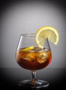 Cognac in a glass with lemon Royalty Free Stock Photo