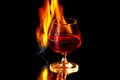 Cognac glass with the burning fire flames Royalty Free Stock Photo