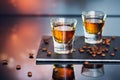 Cognac or liqueur, coffee beans and spices on a glass table. Royalty Free Stock Photo