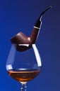 Cognac and pipe Royalty Free Stock Photo