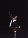 Cognac and pipe Royalty Free Stock Photo